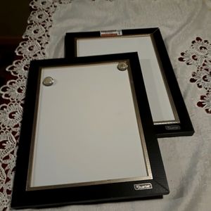 Two white writing boards